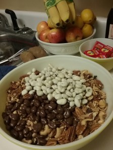 Dump everything in a great big bowl and toss with your fingers till everything is mixed up evenly.